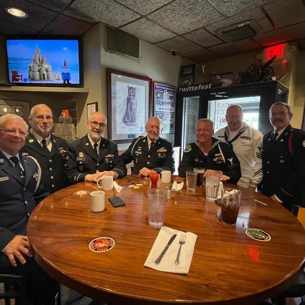 Round table made by son with military branch emblems