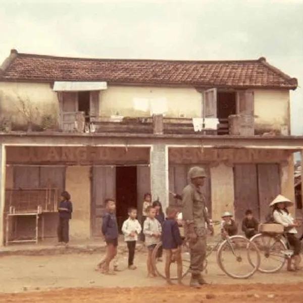 Vietnamese children with GI soldiers